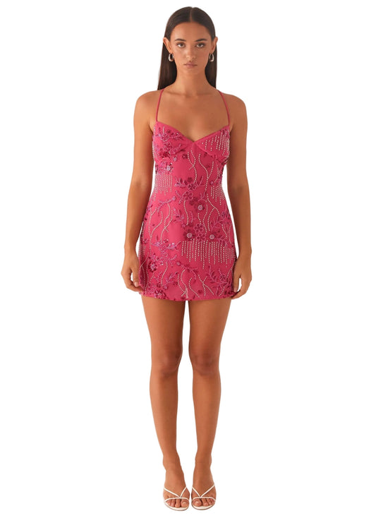 Front view of a women's fuchsia sequin mini dress with intricate floral beadwork and delicate strappy open back details, perfect for a party.