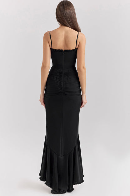 Back view of a black sleeveless ruched ruffle high-low maxi dress, highlighting the elegant silhouette and ruffled detailing.