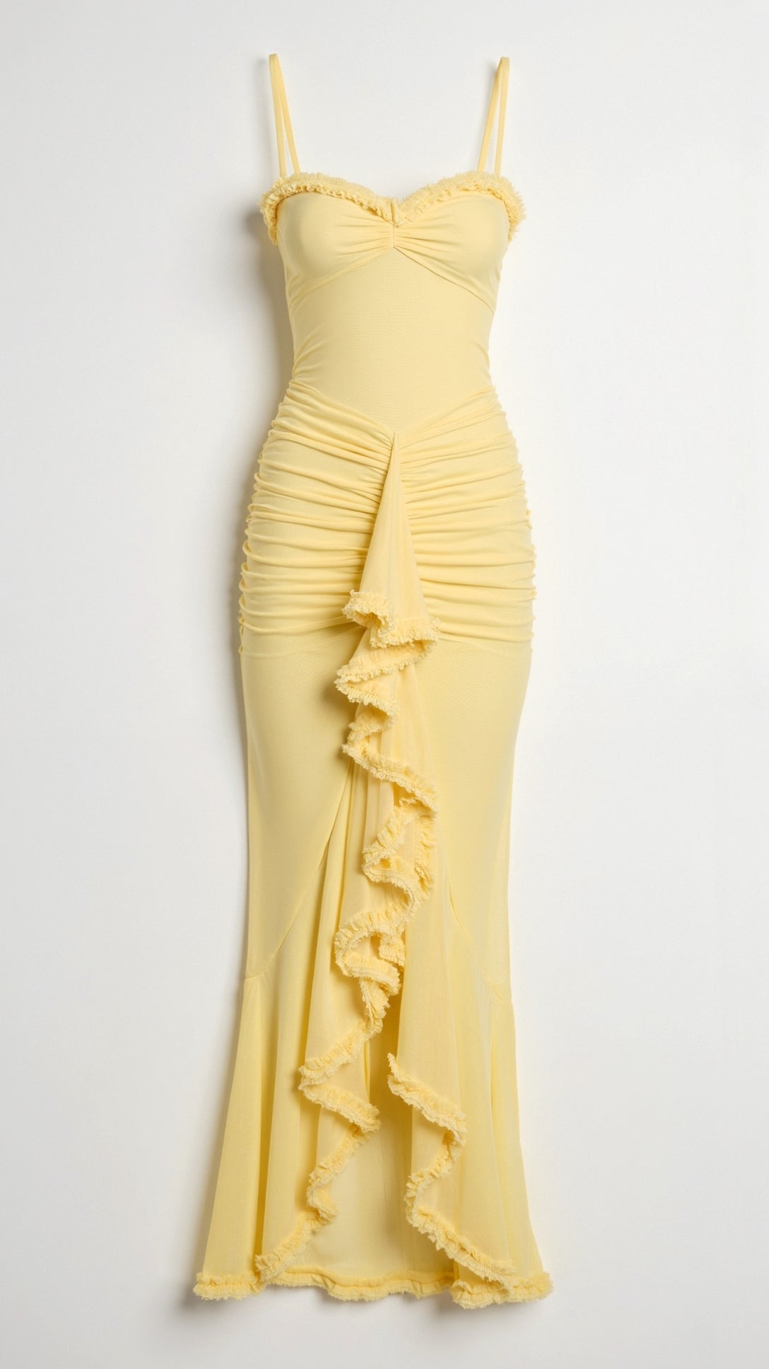 Close-up of a yellow sleeveless ruched ruffle high-low maxi dress, showing the detailed ruching and tiered ruffles.