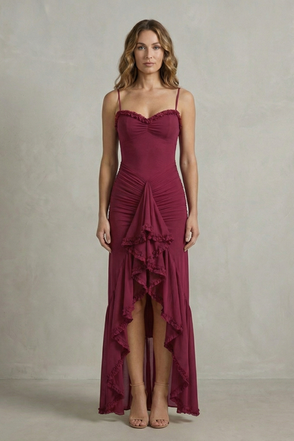Full-length view of a women's elegant burgundy ruched ruffle maxi dress, showcasing the intricate ruching details and tiered ruffles on the skirt, ideal for vacation outfits.