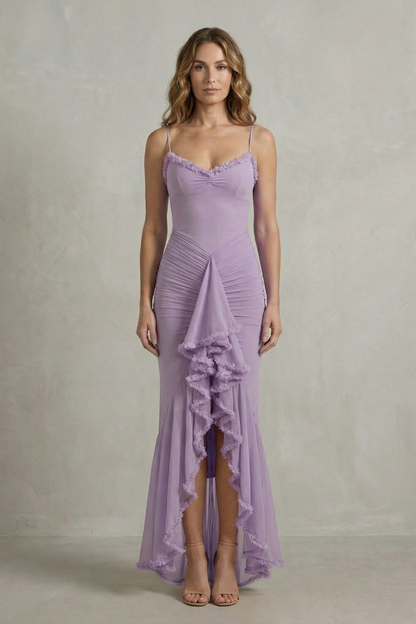 Full-length front view of a woman in a lavender sleeveless ruched ruffle maxi dress, showcasing the flattering silhouette.