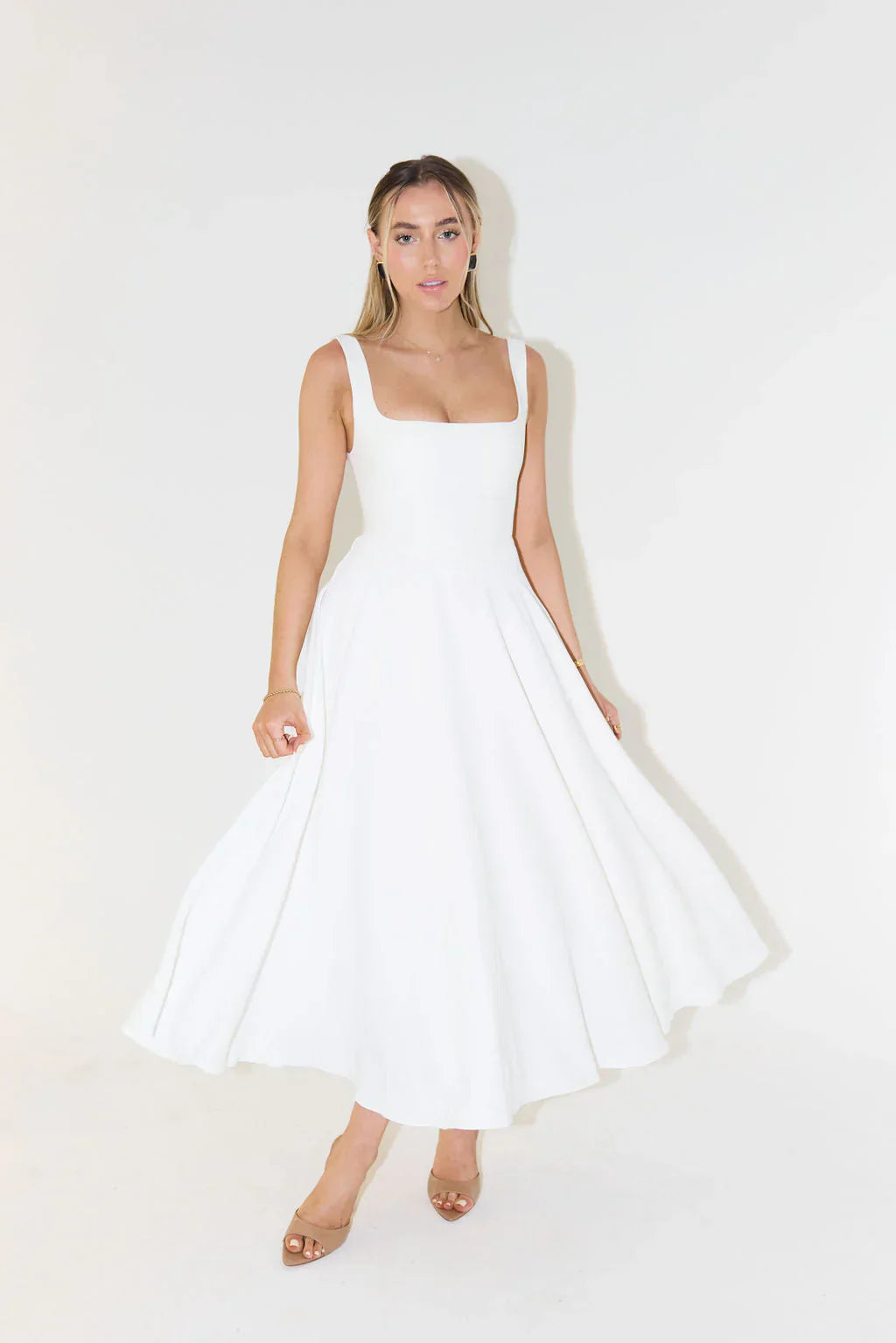 White square neck sleeveless midi dress with a full, flared skirt, suitable as a white silk dress alternative.
