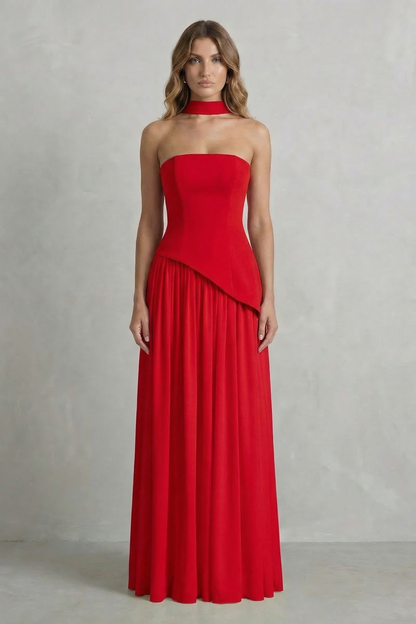 Vibrant red strapless asymmetric maxi dress featuring a structured bodice and a gracefully draped skirt, suitable for women's wedding guest dresses.