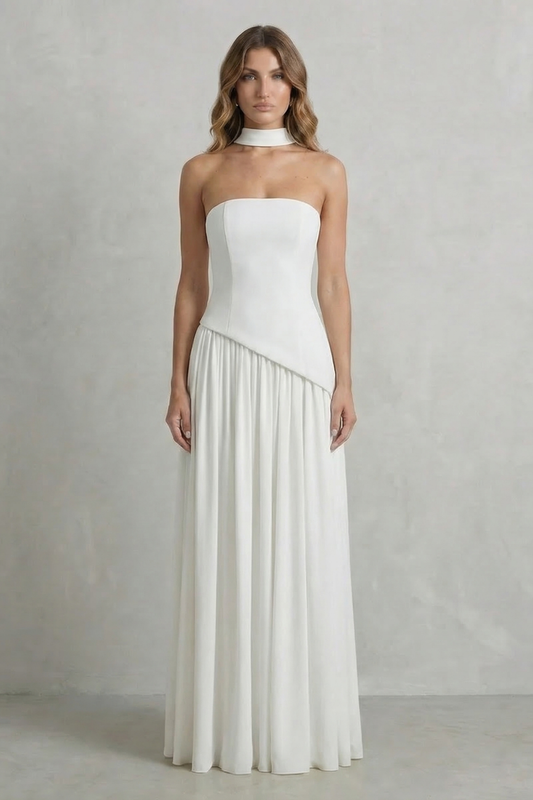 Elegant white strapless asymmetric maxi dress with a flowing skirt and matching choker neckline detail, perfect for wedding guests.