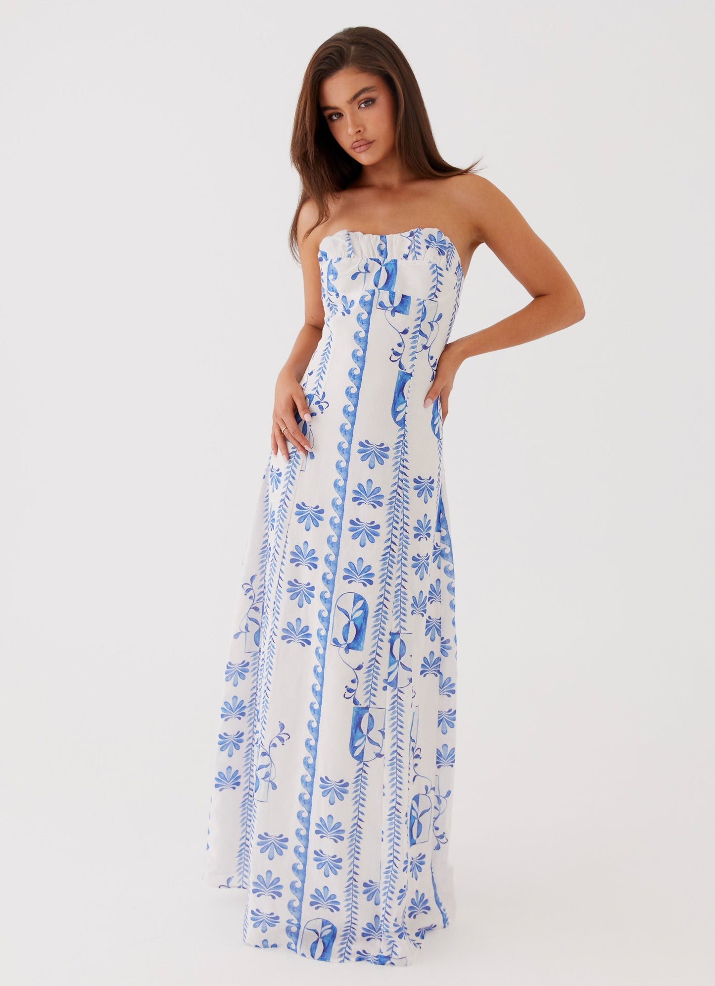 Full view of women's strapless blue floral A-line maxi dress, ideal as a beach dress for women or vacation dress.