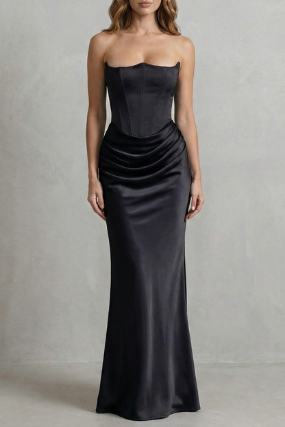 Full-length view of a black satin dress with a strapless corset bodice and gracefully draped maxi skirt.