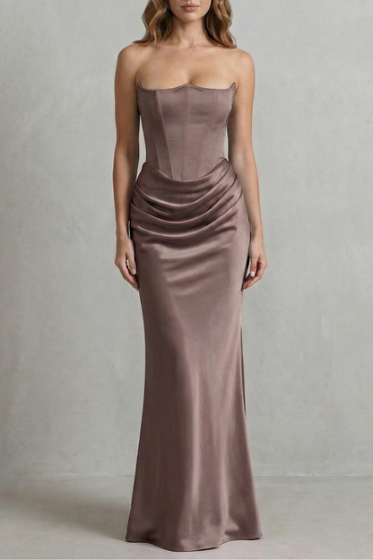Full-length view of a brown-taupe satin maxi dress, designed with a strapless corset and a draped, elegant skirt.