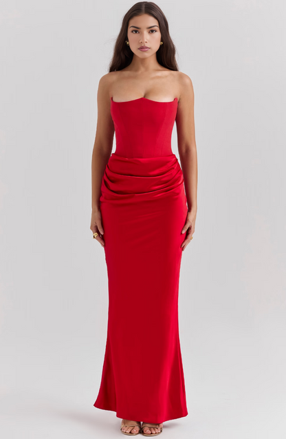Front view of a striking red strapless corset maxi dress, showcasing its form-fitting design and elegant drape.