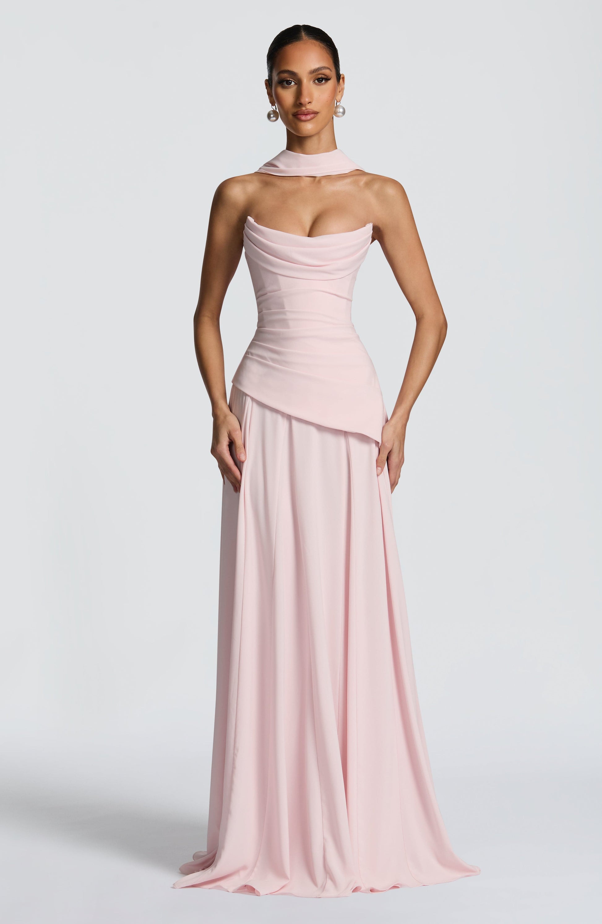 Front view of the pink strapless cowl neck maxi dress, showcasing the draped bodice and long, elegant skirt.