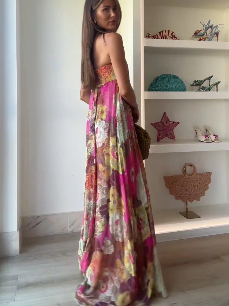 Back view of the women's strapless floral printed maxi dress, showing the flowing fabric and vibrant floral design, perfect as a beach dress for women.