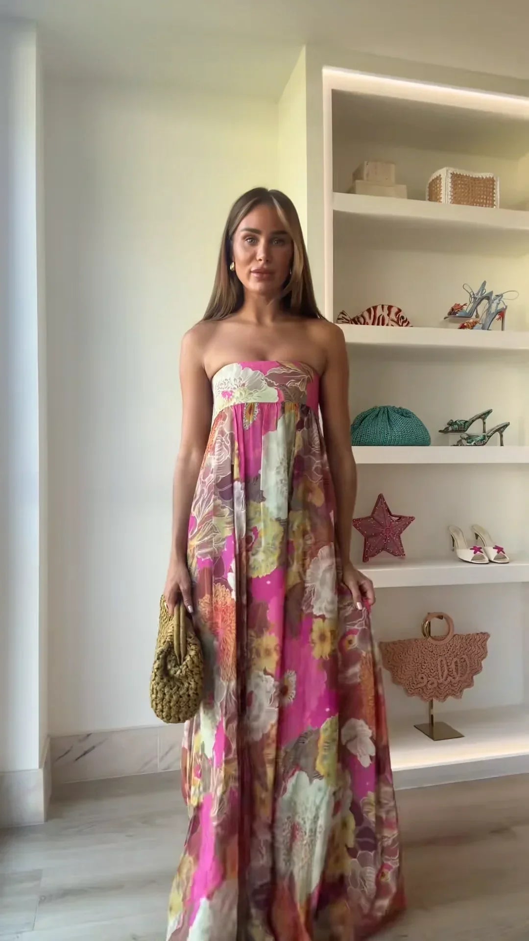 Women's strapless floral printed maxi dress with a straight neckline and a loose, comfortable fit, featuring a colorful floral print in pink, yellow, and green.