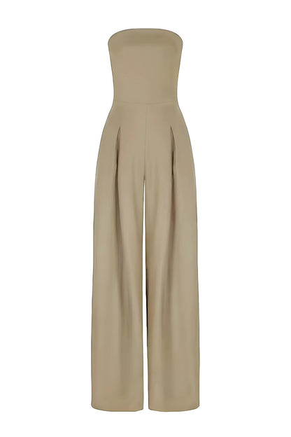 Front view of a beige strapless high-waisted wide-leg jumpsuit, with subtle pleats at the waist and a smooth, flowing fabric, on a white background.
