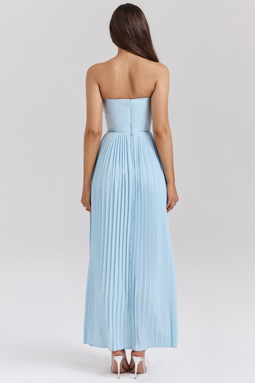 Back view of the light blue strapless pleated midi dress, showcasing the full pleats and zipper detail.