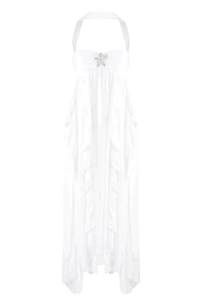 White strapless ruched ruffle maxi dress with a halter neckline and a prominent silver star detail on the bodice.