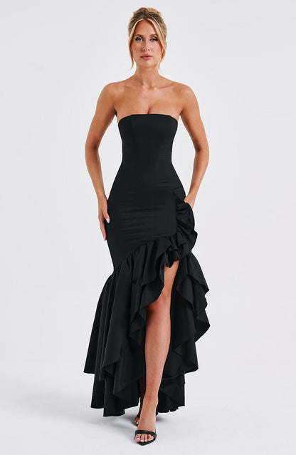 Black strapless ruffle high-low maxi dress with a fitted silhouette and cascading ruffles on the skirt, front view.