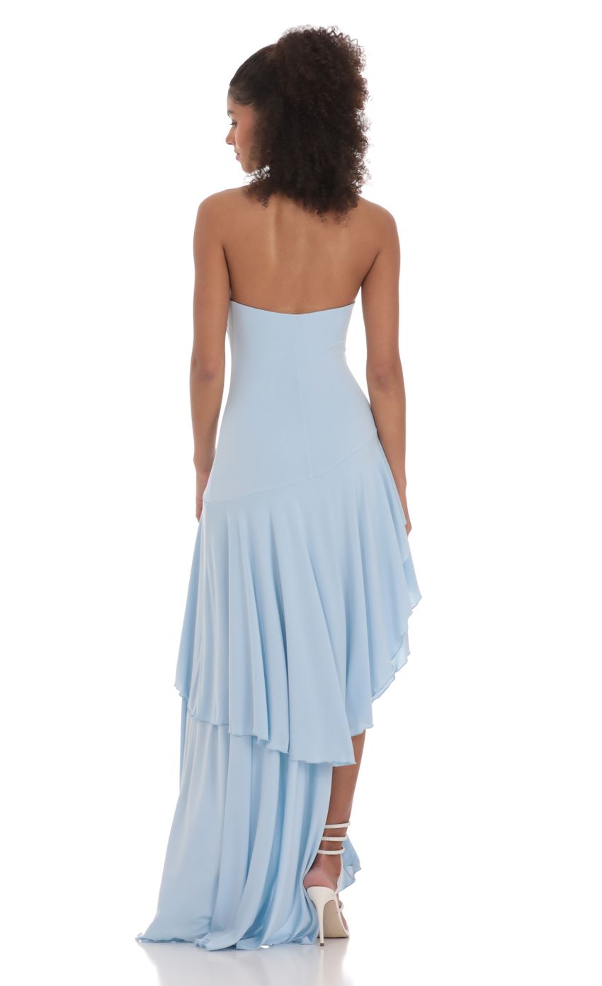 Light blue strapless ruffled high-low maxi dress, back view with long train and layered hem