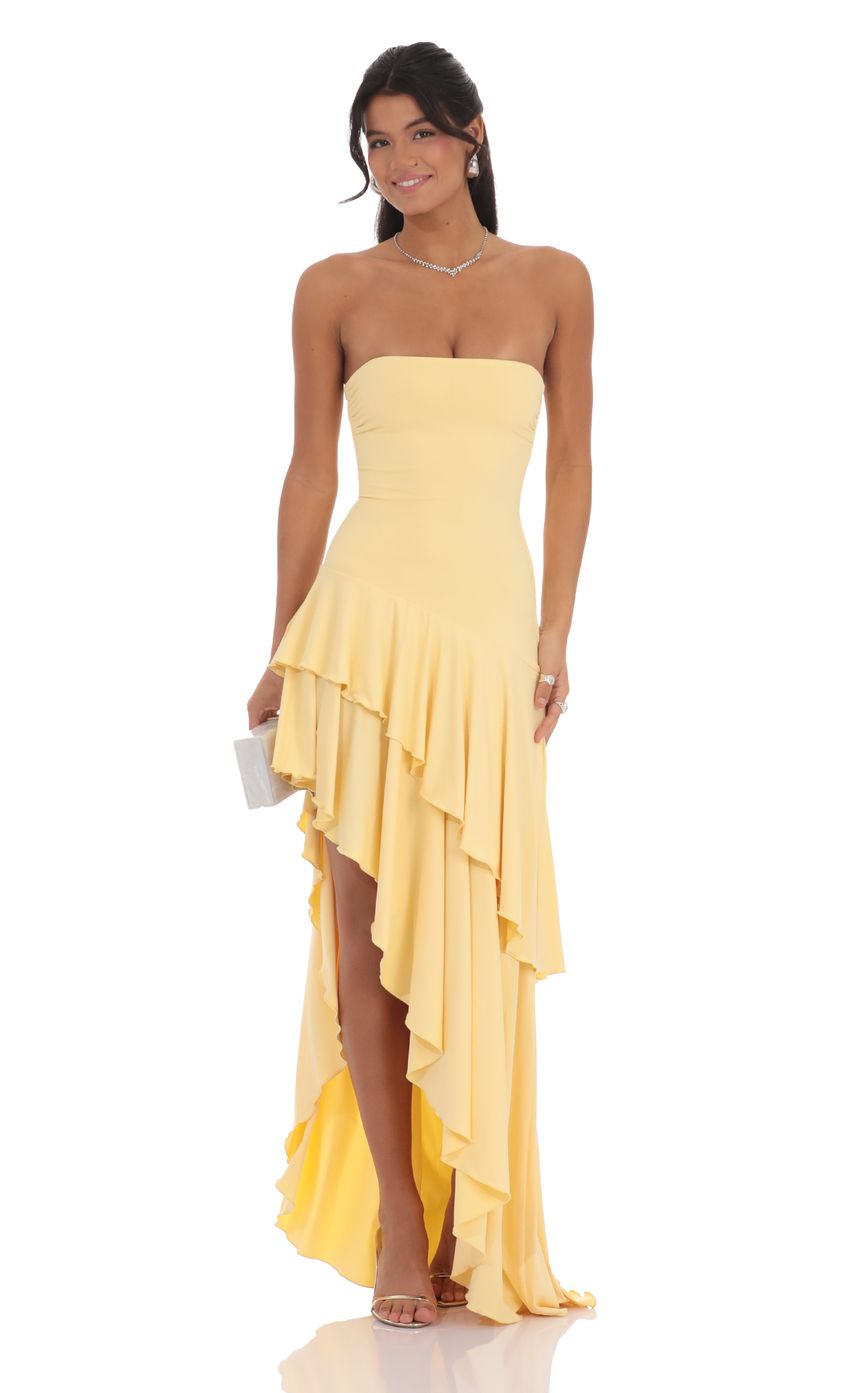 Pale yellow strapless ruffled high-low maxi dress, front view with tiered waterfall hem