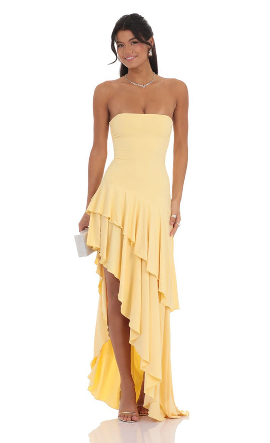 Pale yellow strapless ruffled high-low maxi dress, front view with tiered waterfall hem