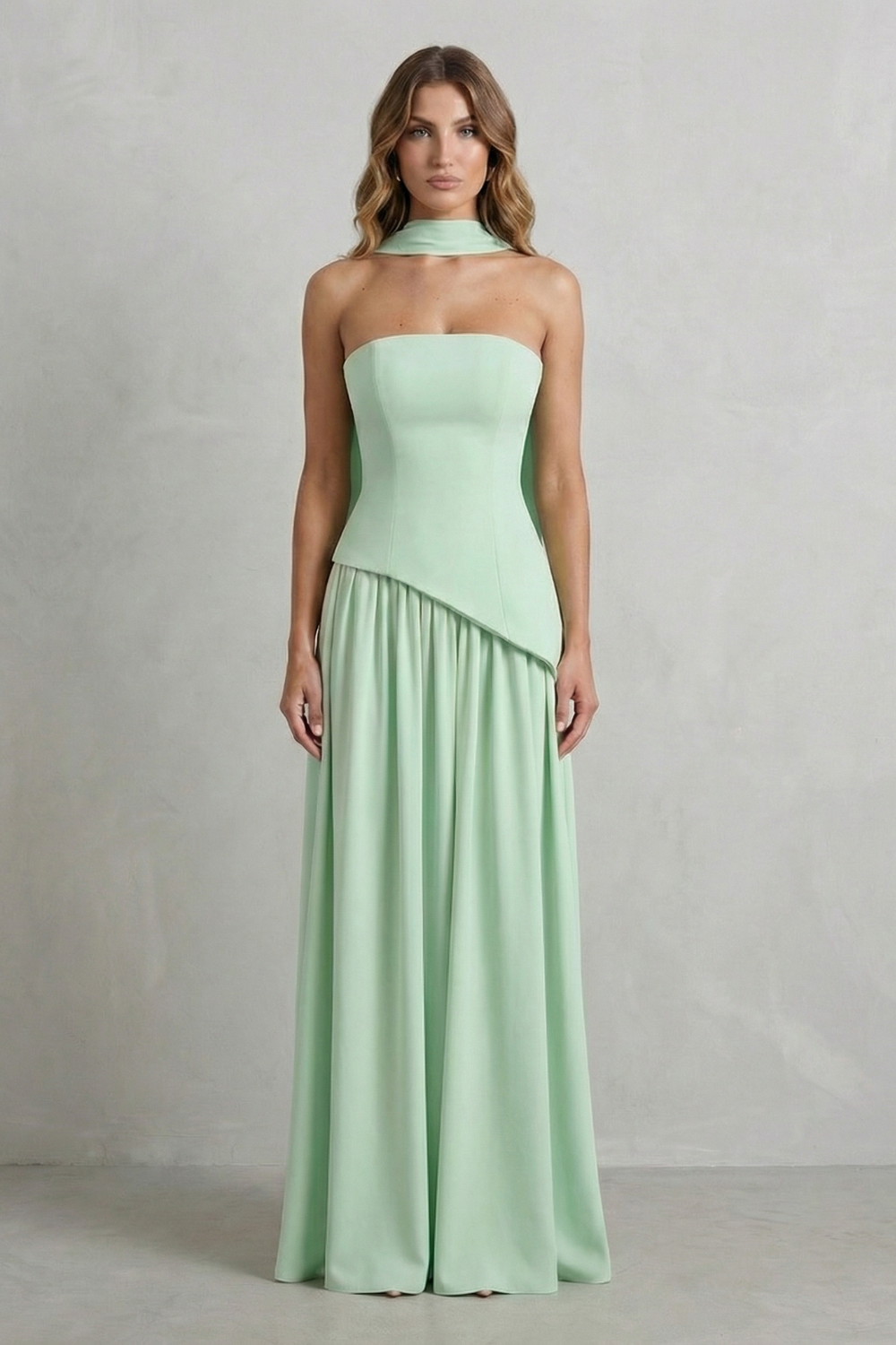 Mint green strapless maxi dress featuring a draped neck scarf and an asymmetric bodice, a stylish choice for women's wedding guest dresses.