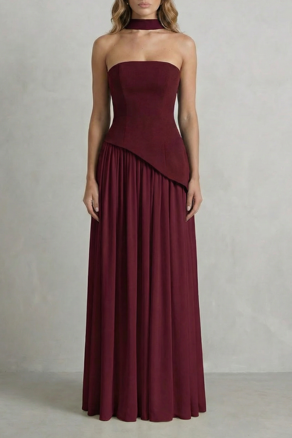 Burgundy strapless maxi dress with a sophisticated draped bodice and a long, pleated skirt, an elegant choice for women's wedding guest dresses.