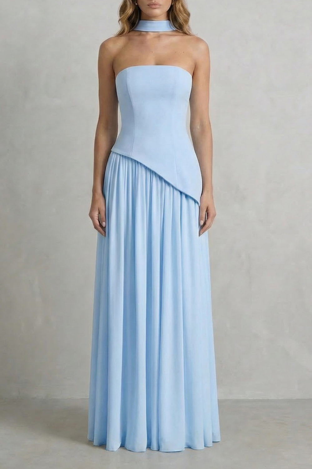 Full-length light blue strapless maxi dress with a draped neck detail and a subtly pleated skirt, ideal for elegant occasions.