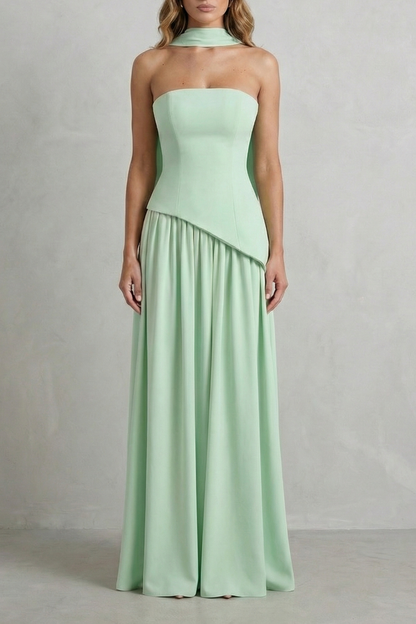 Full-length mint green strapless maxi dress with a draped neck detail and flowing skirt, elegant for wedding guests or vacation.