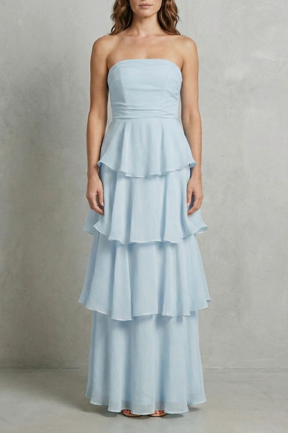 Full-length view of a light blue strapless tiered ruffle maxi dress, perfect for a beach dress.