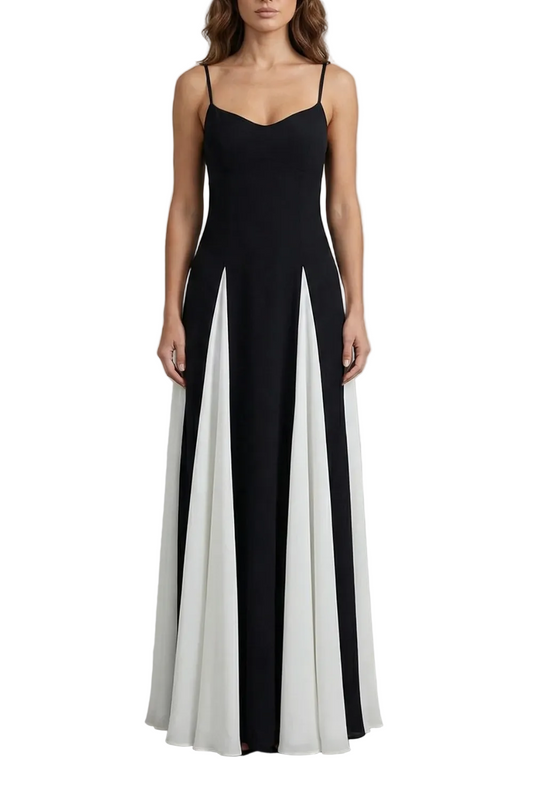 Full-length black and white color block maxi dress with thin straps and sweetheart neckline, perfect for wedding guests.