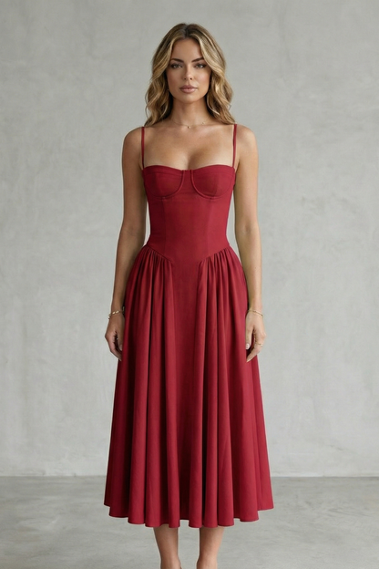 Front view of a woman wearing a vibrant red strappy structured sweetheart neck midi dress, showcasing the elegant silhouette.