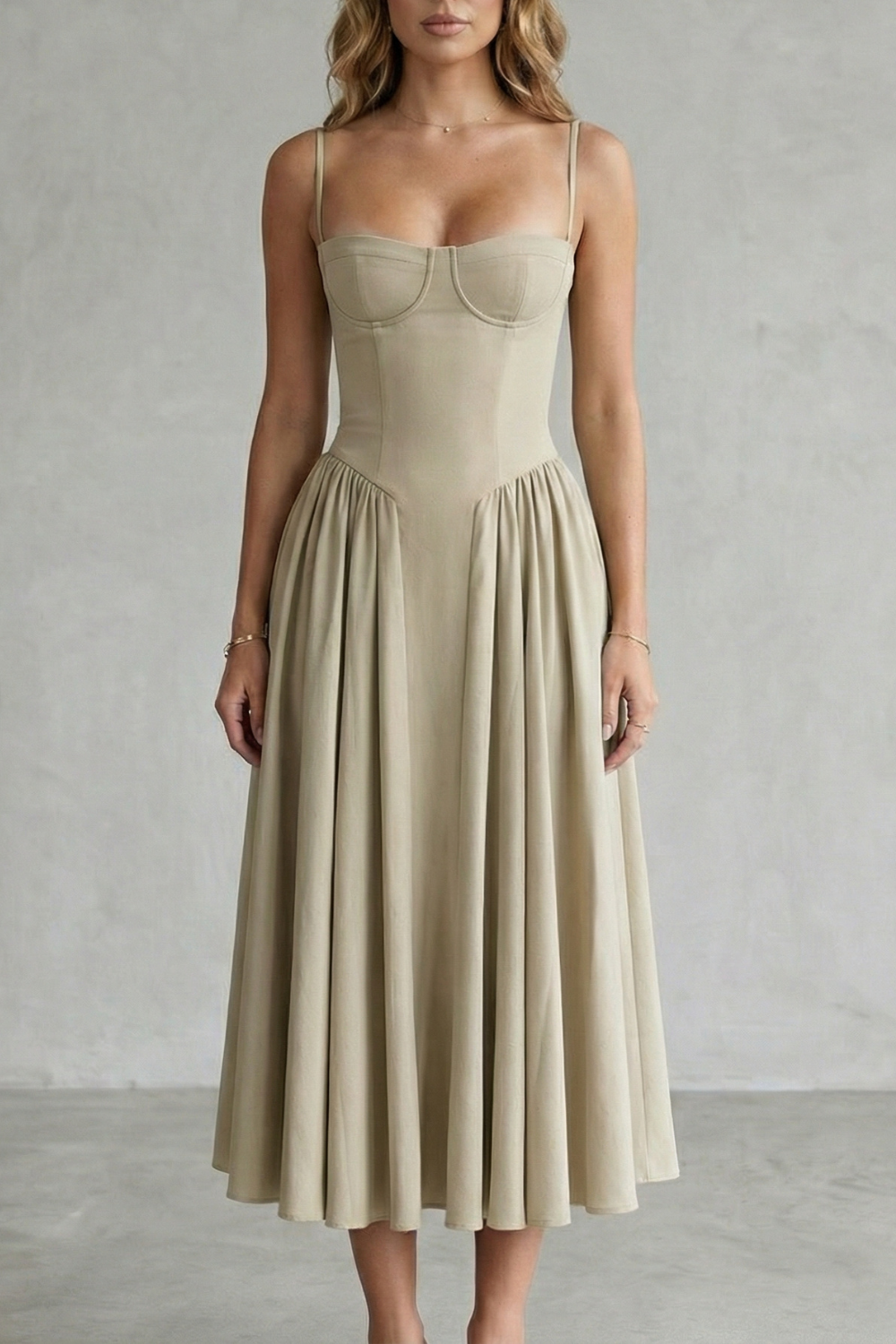 Beige structured sweetheart neck midi dress with slim straps and a pleated A-line skirt, a versatile midi dress.