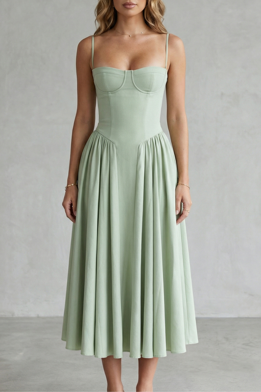 Light green structured sweetheart neck midi dress with spaghetti straps and pleated full skirt, elegant for wedding guests.