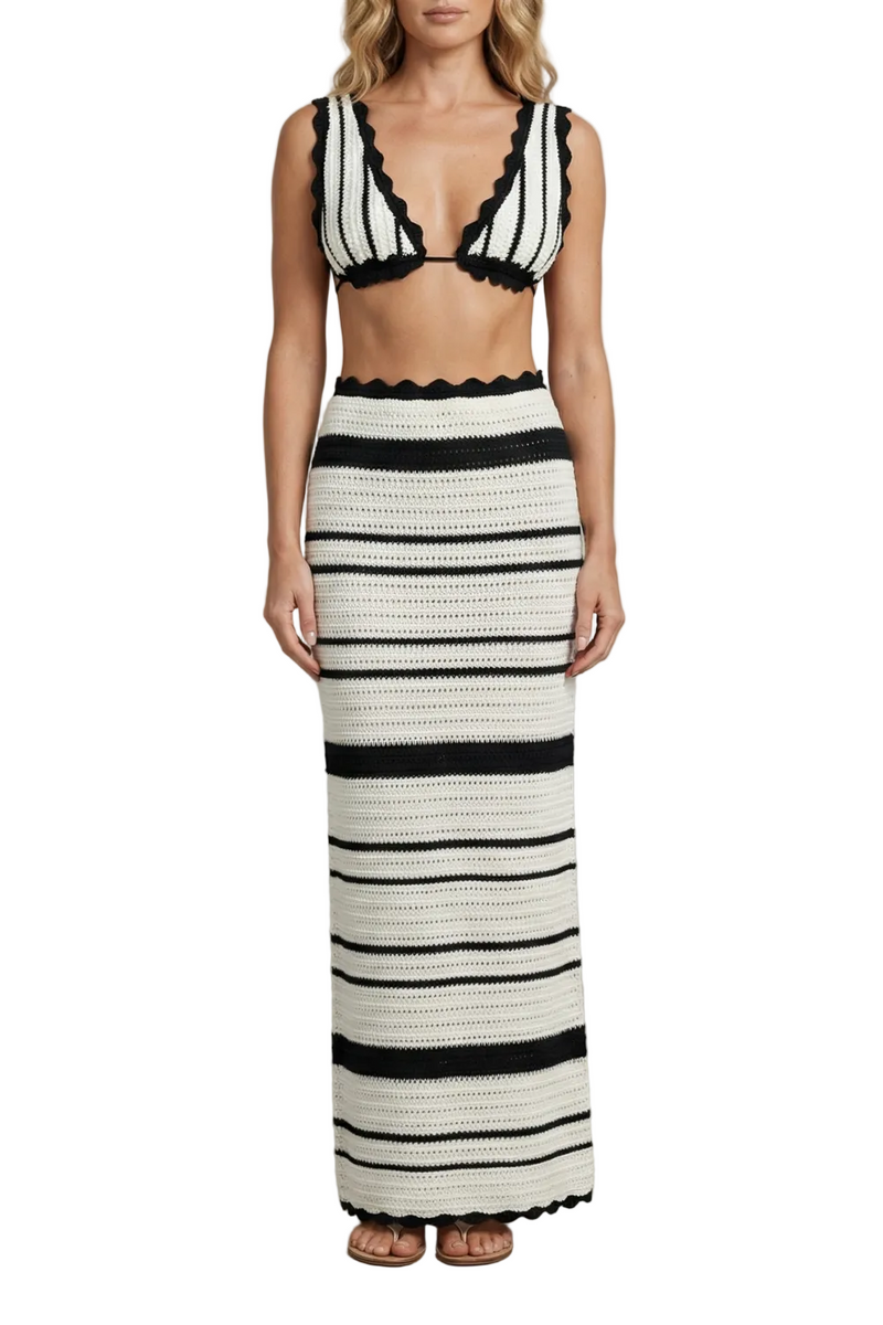 Front view of a women's striped scalloped crochet maxi skirt set in black and white with a v-neck top.