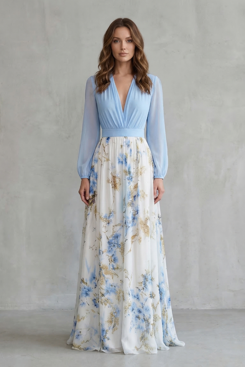 Elegant women's summer floral V-neck maxi dress featuring a light blue long-sleeve bodice and a flowing white skirt with blue and gold botanical patterns.
