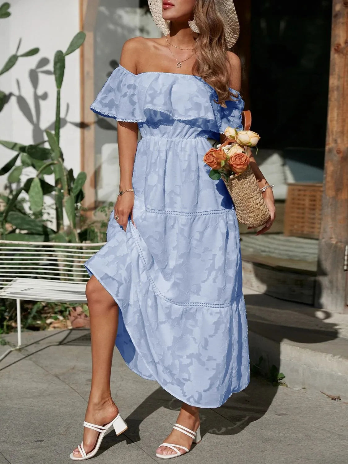 Light blue off-shoulder tiered maxi dress, featuring a ruffled neckline and textured fabric, perfect as a beach dress for women or vacation outfit.