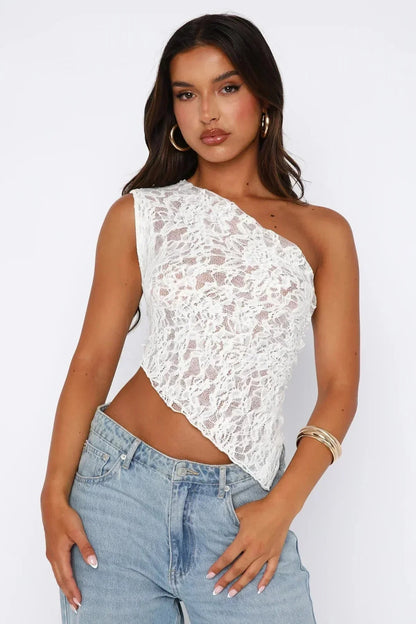 White one shoulder lace crop top, front view showing sheer lace overlay and asymmetrical hem