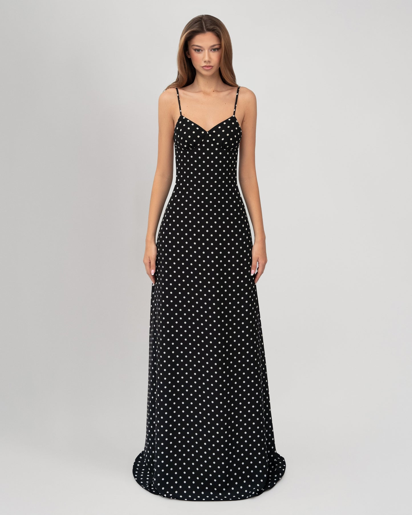 Front view black polka dot sweetheart neckline maxi dress with fitted bodycon-style silhouette