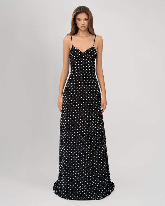 Front view black polka dot sweetheart neckline maxi dress with fitted bodycon-style silhouette