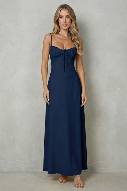 Full-length front view of a women's dark blue maxi dress, designed with a sweetheart neckline and a flattering silhouette.