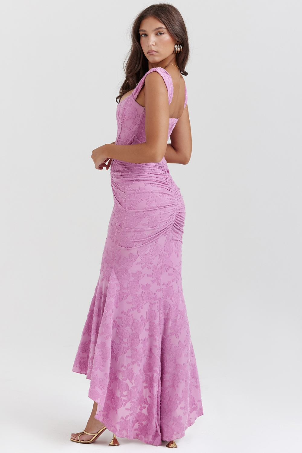 Side view of a lavender floral lace midi dress, highlighting the ruched texture and elegant flow of the skirt.