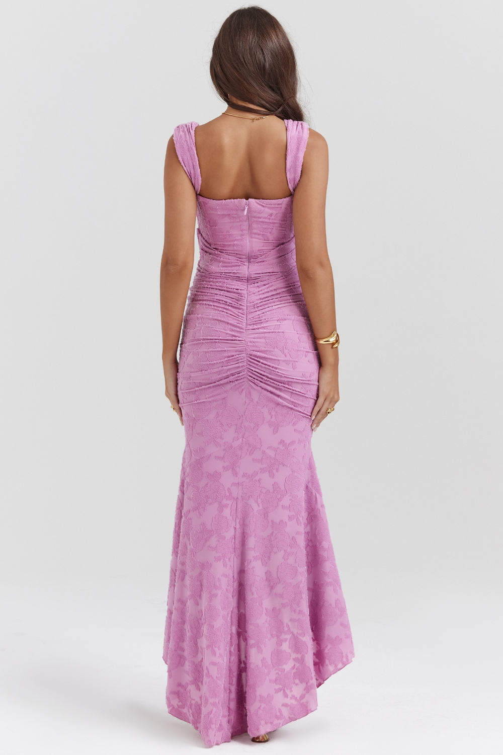 Back view of a lavender floral lace midi dress, showing the subtle floral pattern and ruched back details.