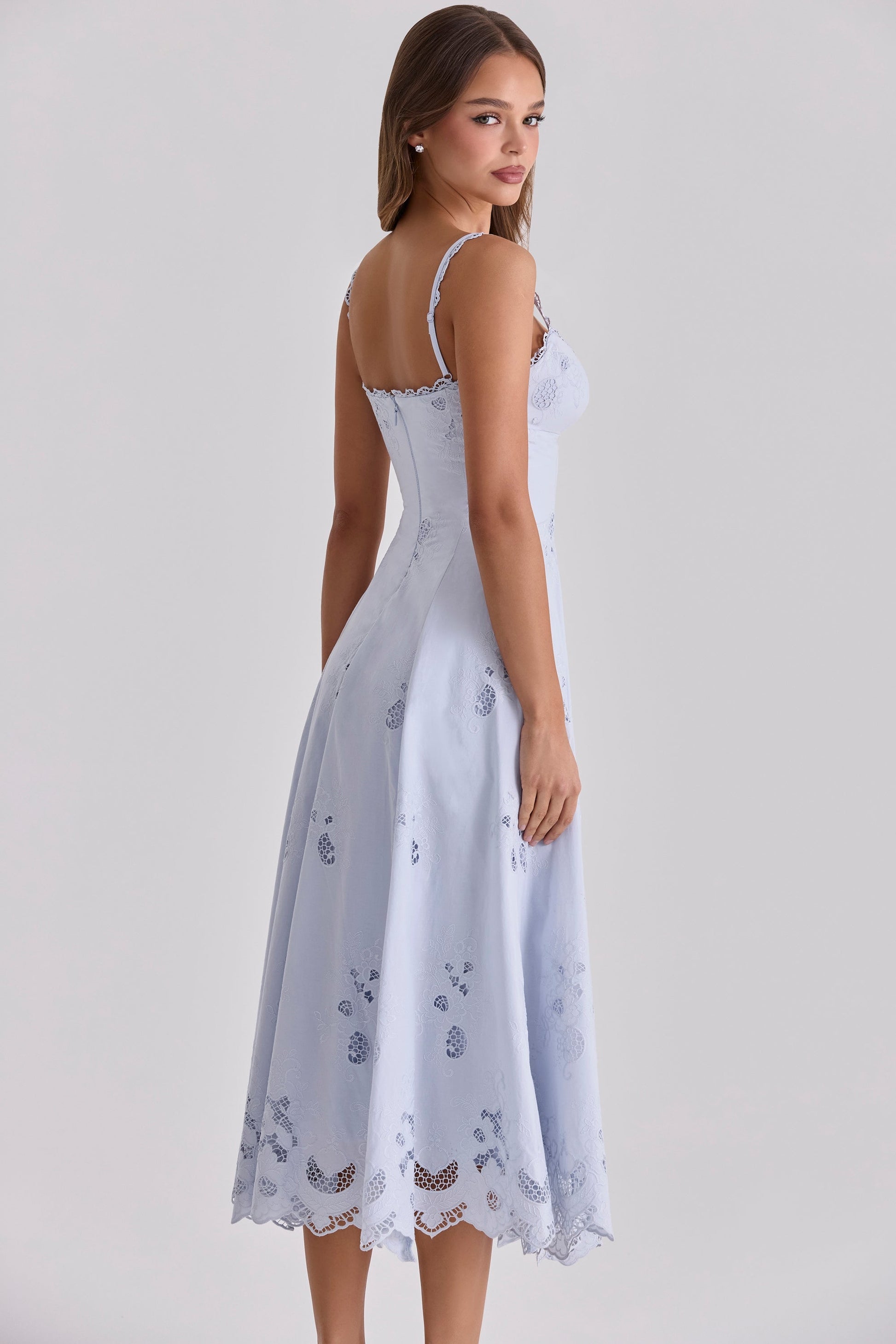 Side back view of light blue maxi dress with lace-trim straps, back zipper, and flowing skirt