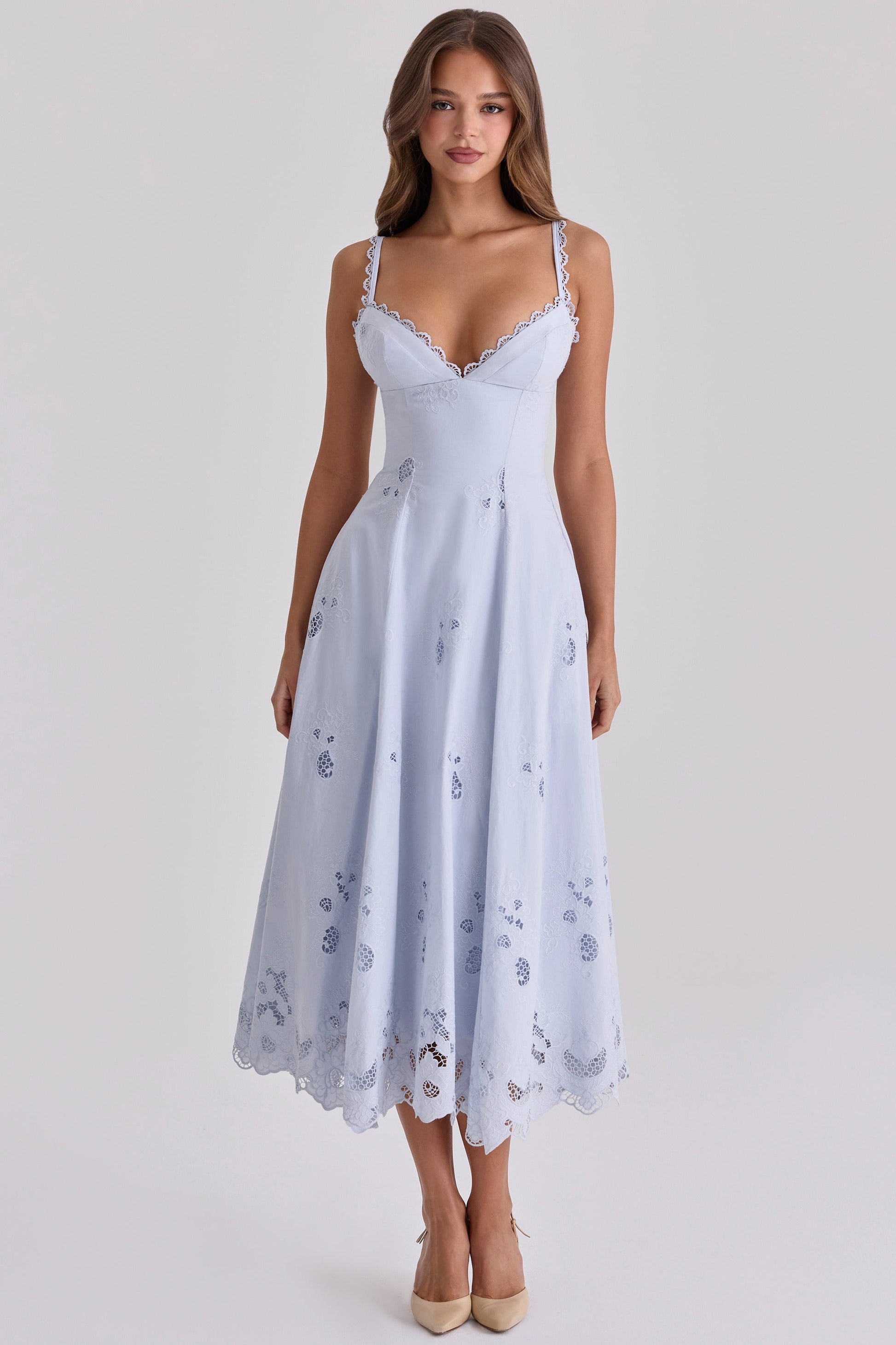Front view of light blue maxi dress with lace-edged straps, fitted waist, and cutwork hem