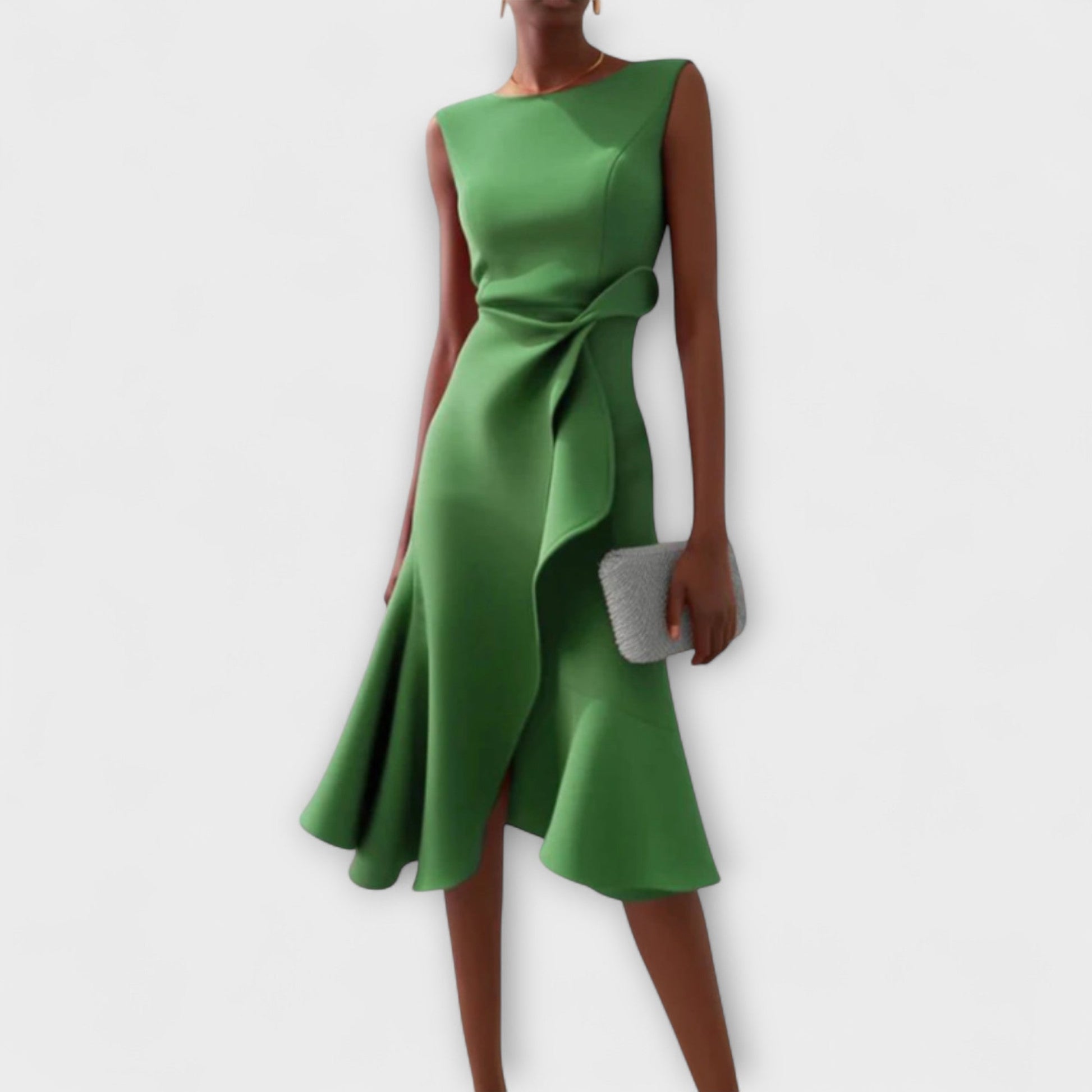 Emerald green sleeveless midi dress with a unique asymmetric ruffle and a sophisticated self-tie waist, a perfect vacation dress.