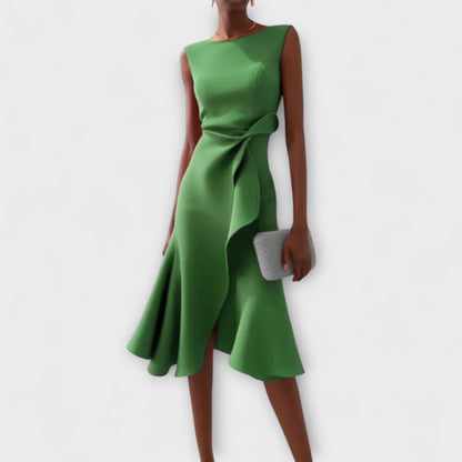 Emerald green sleeveless midi dress with a unique asymmetric ruffle and a sophisticated self-tie waist, a perfect vacation dress.