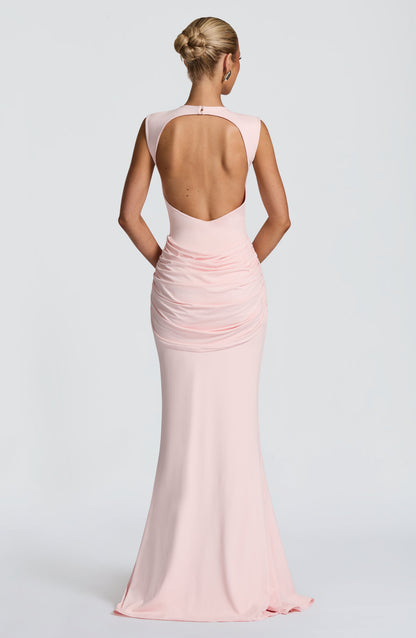 Back view blush pink backless maxi dress with large open cutout and ruched skirt detailing