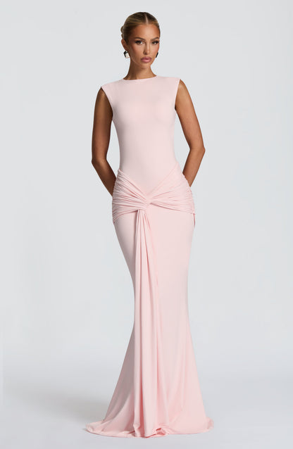 Blush pink sleeveless maxi dress with ruched waist knot and draped front, bodycon fit