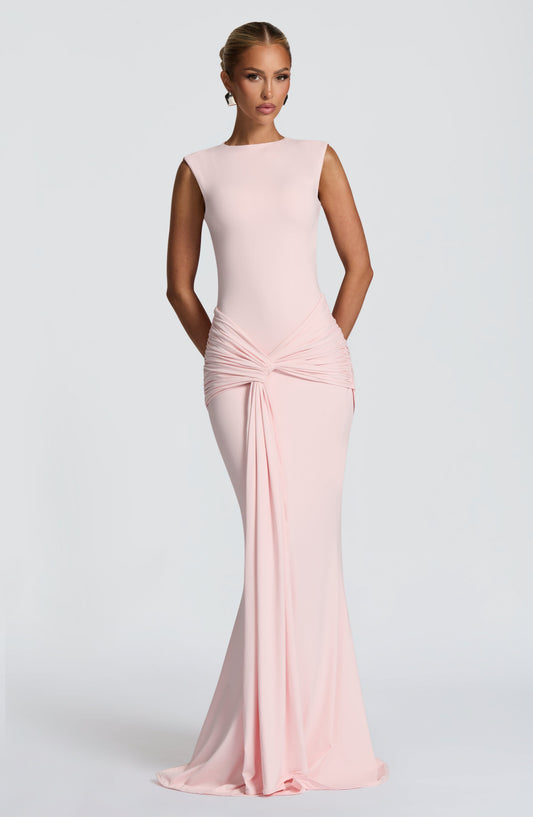 Blush pink sleeveless maxi dress with ruched waist knot and draped front, bodycon fit