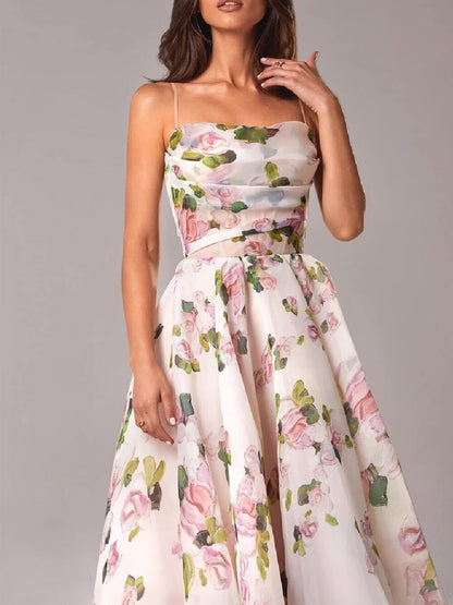 Close-up of the women's floral cowl neck midi dress in white with pink and green floral pattern, highlighting the delicate fabric and bodice detail.