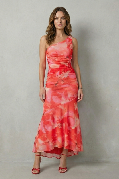 Women's elegant floral one shoulder maxi dress in vibrant red and pink, with a ruched bodice and high-low hem, suitable for wedding guests.