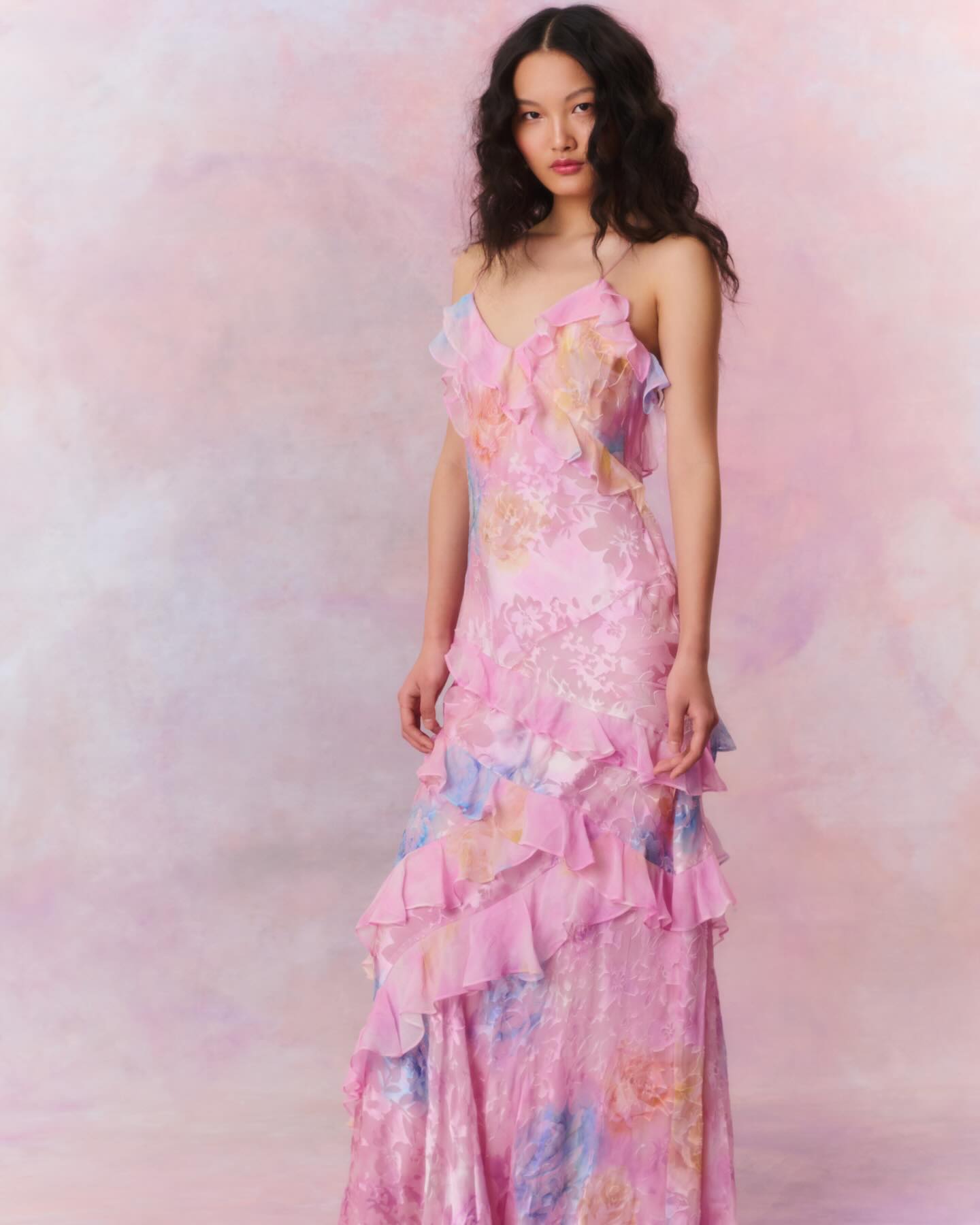 Pink pastel floral slip maxi dress with spaghetti straps and tiered ruffle skirt, wedding guest style